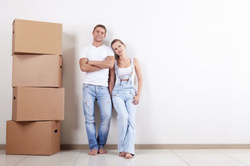 Removal team handling boxes and furniture for a South Kensington home move