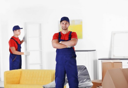 Mover protecting property while carrying furniture through a doorway