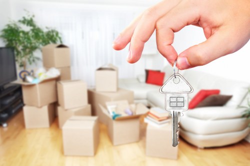 Staff using correct lifting techniques during a moving job