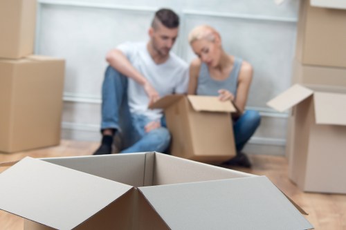 Careful packing of fragile household items in South Kensington