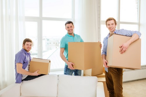 Moving large furniture through a South Kensington property with expert handling