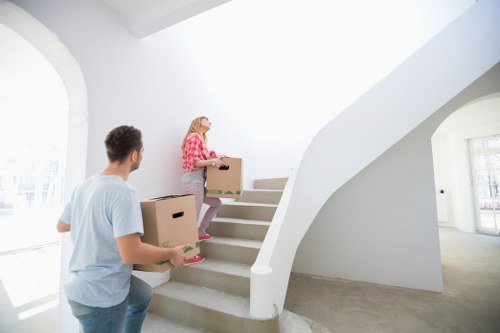 Professional team handling desks and office equipment during a South Kensington move