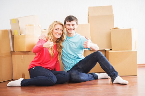 Professional mover carrying boxes for a South Kensington move