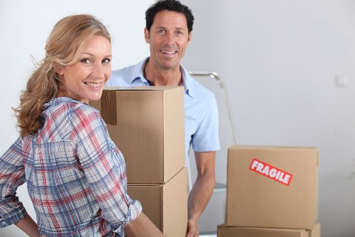 Professional movers loading a van for a quick relocation